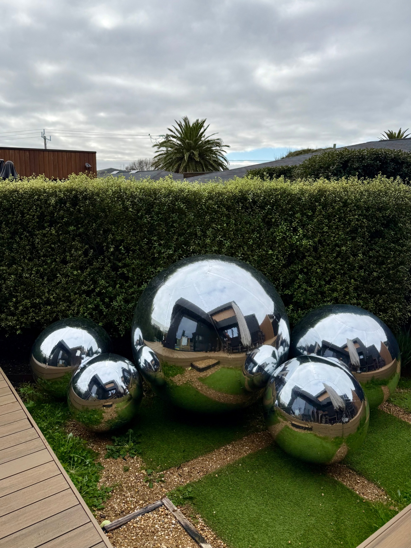 Silver mirror sphere cluster in a private garden